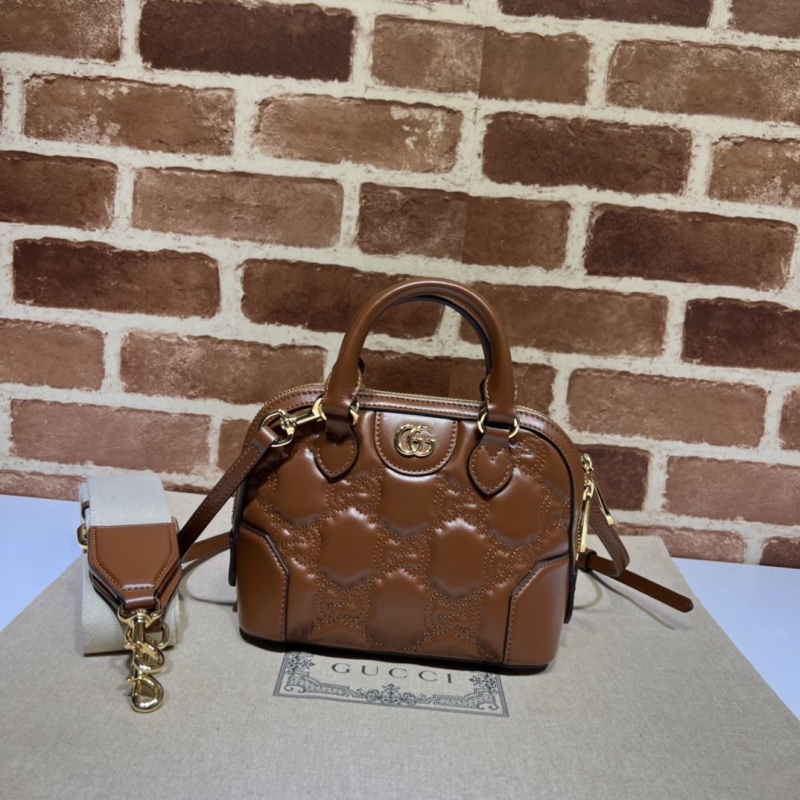 G*u*i top handle bags